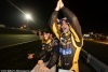 Nick Heidfeld and Nicolas Prost celebrate as Neel Jani takes the checkered flag