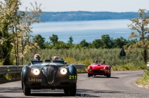 1951 Jaguar XK 120 Sports Ecurie Ecosse piloted by Jay Leno and Ian Callum and 1953 Ferrari 375 MM Spider Pinin Farina